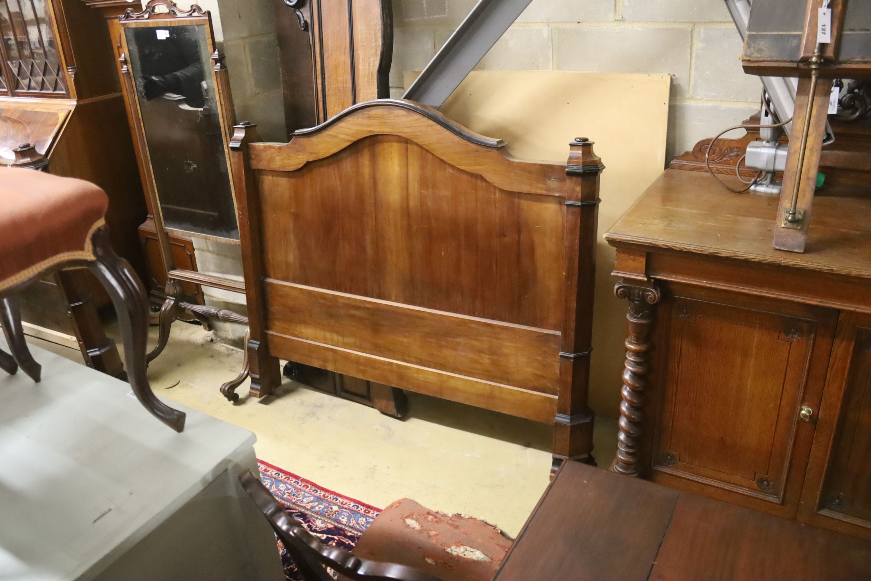 A 19th century French part ebonised walnut double bed frame, width 130cm